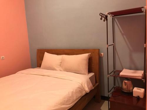 RoomZ Budget Residence客房内的一张或多张床位