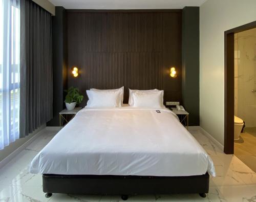Luminor Hotel Tanjung Selor By WH客房内的一张或多张床位