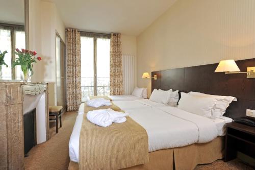 瓦鲁圣日耳曼酒店客房内的一张或多张床位