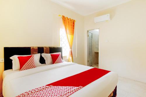 OYO 3252 Lansano Residence Syariah客房内的一张或多张床位