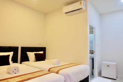 Vamin Resort Chiangkhan Loei วามินทร์รีสอร์ท เชียงคาน เลย客房内的一张或多张床位