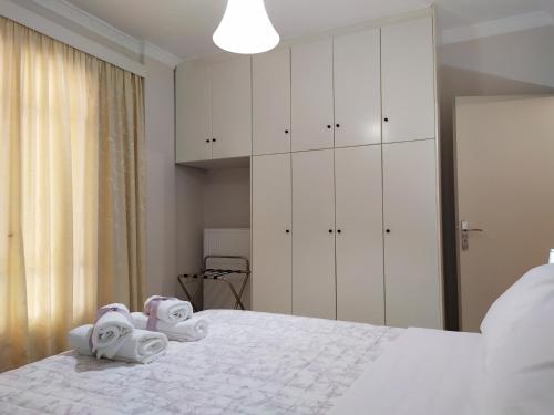 Nafplio City Apartments客房内的一张或多张床位