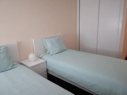 Apartamentos Finisterre Atlántico客房内的一张或多张床位