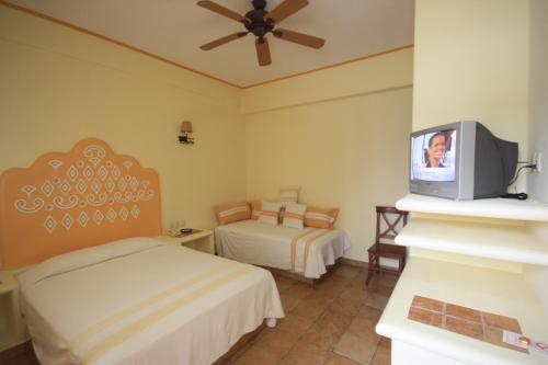 Hotel Maria Mixteca客房内的一张或多张床位