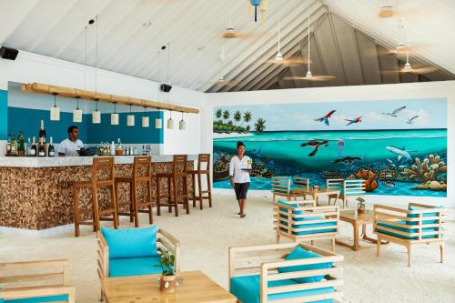 南马累环礁Sun Siyam Olhuveli的海洋壁画餐厅的 ⁇ 染