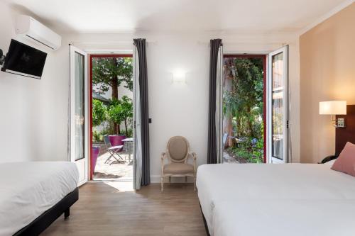 The Originals Boutique, Hôtel des Orangers, Cannes (Inter-Hotel)客房内的一张或多张床位