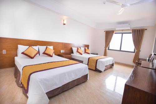 Khách sạn Tú Phương - Hải Tiến客房内的一张或多张床位