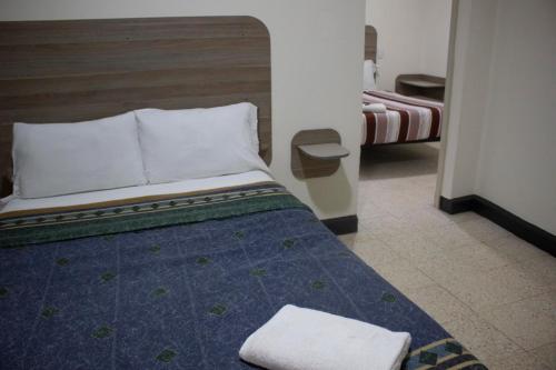 Hotel Winn Comfort客房内的一张或多张床位