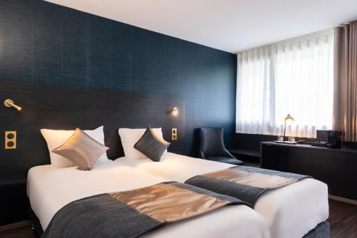 The Originals City, Hôtel Rennes Sud (Inter-Hotel)客房内的一张或多张床位