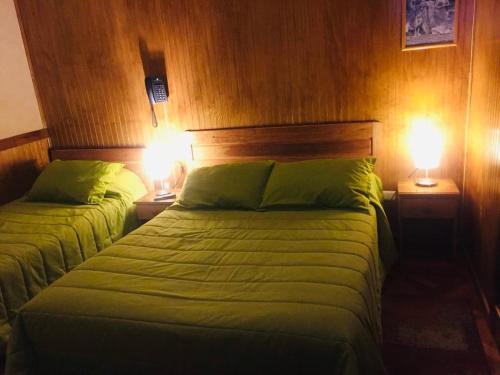 Hostal Chalet Las Violetas客房内的一张或多张床位