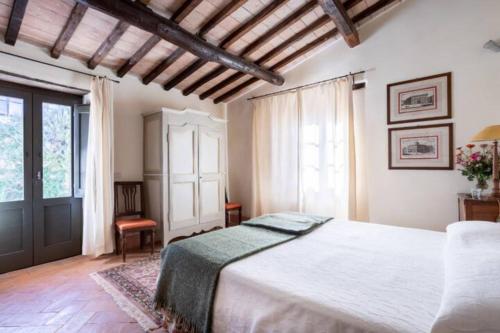 Villa della Genga Country Houses客房内的一张或多张床位