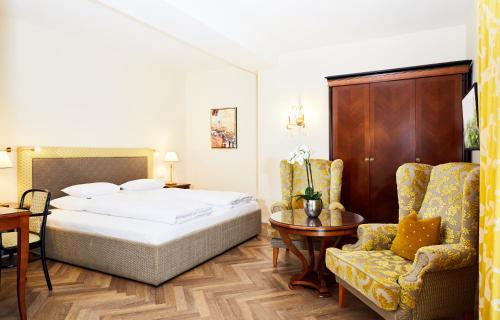 Parkhotel Graz - Traditional Luxury客房内的一张或多张床位