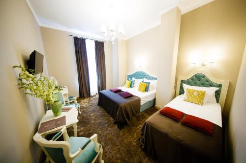 Grand Hotel Traian客房内的一张或多张床位