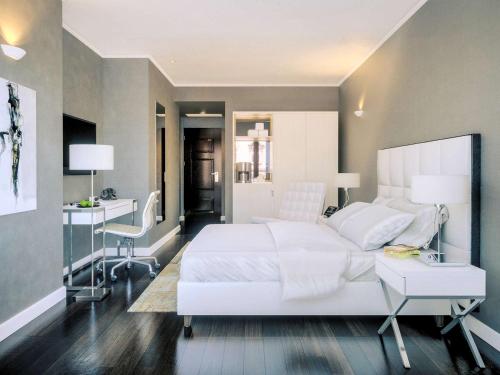 维也纳拉斐尔美居酒店客房内的一张或多张床位