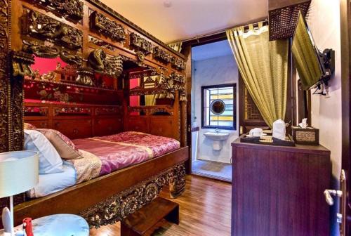 สงขลาแต่แรก แอนทีค โฮเท็ล Songkhla Tae Raek Antique Hotel客房内的一张或多张床位