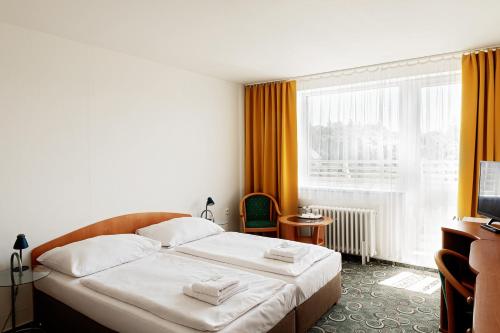 斯勒赞酒店客房内的一张或多张床位