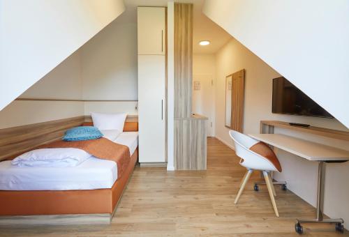 VR-Serviced Apartments Obergeis客房内的一张或多张床位