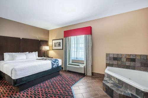 康威拉昆塔套房酒店 客房内的一张或多张床位
