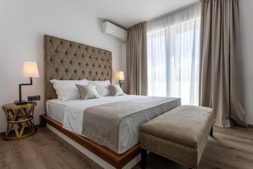 Hotel & Resort ISOLA客房内的一张或多张床位