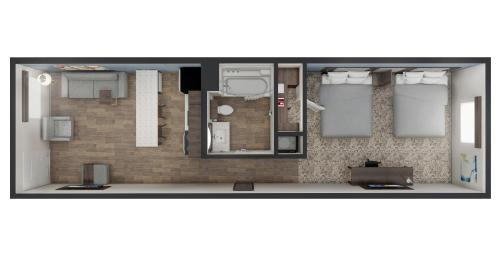 戈尔兹伯勒stayAPT Suites Goldsboro-Seymour Johnson AFB的小型公寓的平面图,设有房间