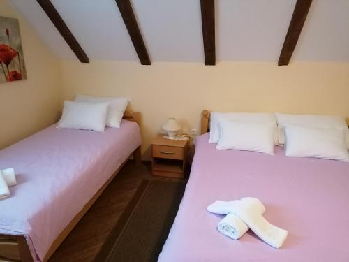 豪斯伊兹沃尔酒店客房内的一张或多张床位