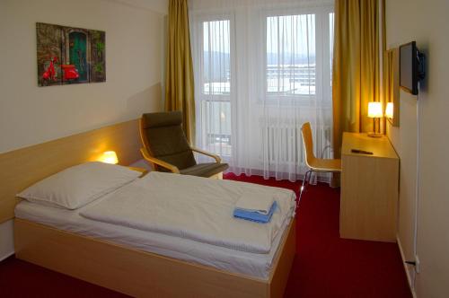 Hotel Centrum Brno客房内的一张或多张床位