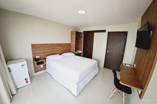 Hotel Orla do Rio Branco客房内的一张或多张床位