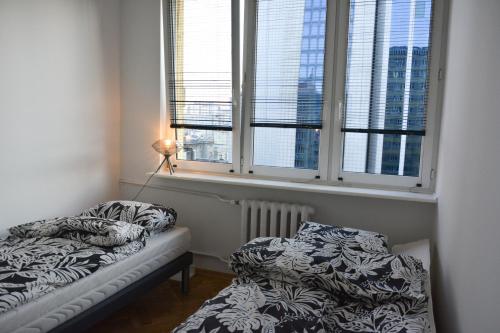 Apartament Centrum Warszawy客房内的一张或多张床位