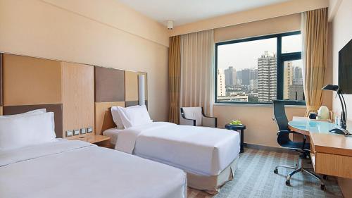 河南中州智选假日酒店客房内的一张或多张床位