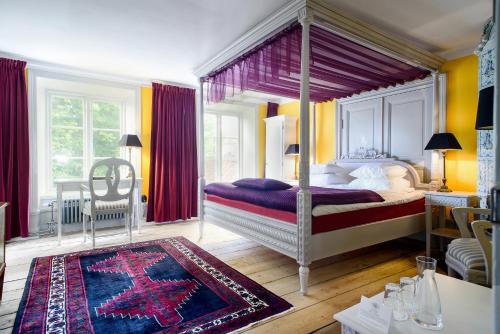 赫尔斯顿斯马尔加德酒店客房内的一张或多张床位