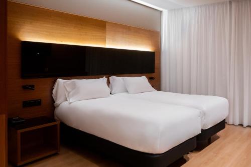 Hq拉加勒瑞尔酒店客房内的一张或多张床位