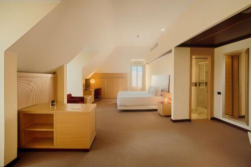 NH米兰2酒店客房内的一张或多张床位