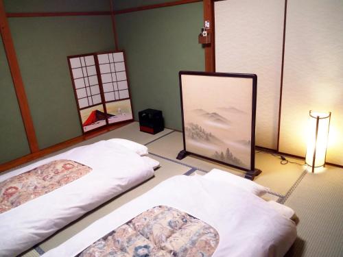 Kyoto Villa Kotone客房内的一张或多张床位