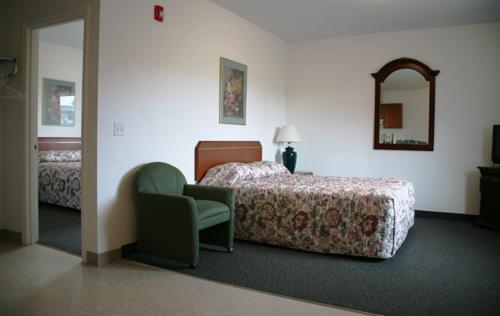 Ponderosa Motel汽车旅馆客房内的一张或多张床位