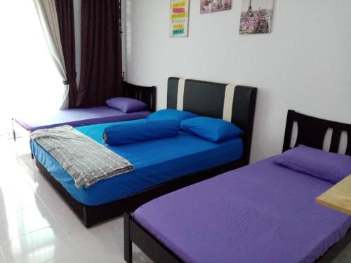 Homestay Seri Takir客房内的一张或多张床位