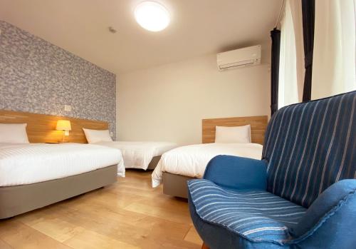 花藤旅館酒店客房内的一张或多张床位
