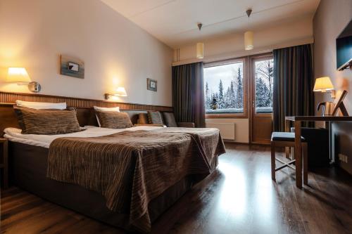 拉普兰罗斯托图恩图瑞酒店及紫水晶Spa客房内的一张或多张床位