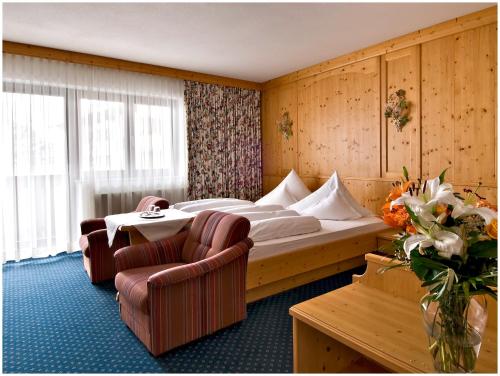 "Quality Hosts Arlberg" Hotel Garni Mössmer客房内的一张或多张床位