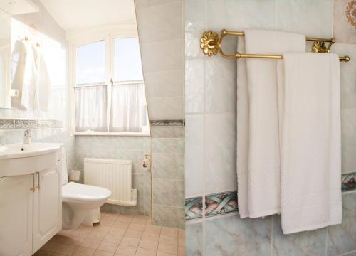 RimboJohannesbergs Slott的浴室设有卫生间和带白色毛巾的淋浴。