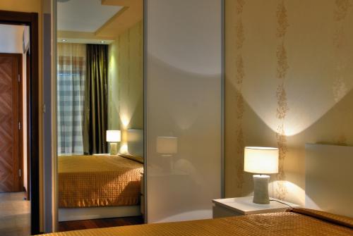 阿托斯公寓式酒店客房内的一张或多张床位