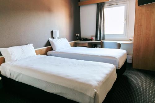 纽卡斯尔宜必思酒店客房内的一张或多张床位