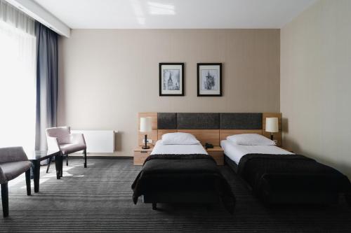 Focus Hotel Premium Elbląg客房内的一张或多张床位