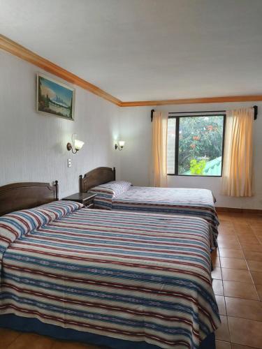 佩拉玛雅酒店客房内的一张或多张床位