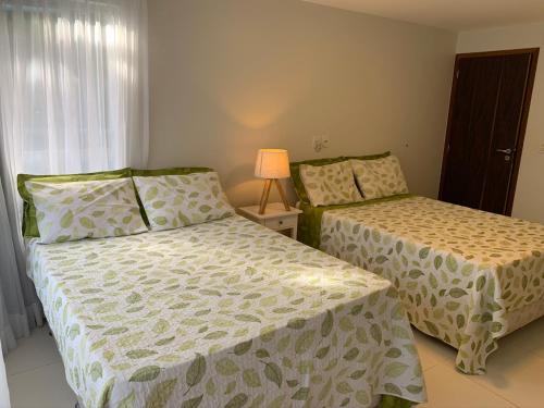 Resort Villas do Pratagy客房内的一张或多张床位