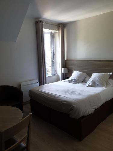 L'Hotellerie de la Toile à Beurre客房内的一张或多张床位