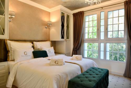 Villa Giardino Heritage Boutique Hotel Bol客房内的一张或多张床位