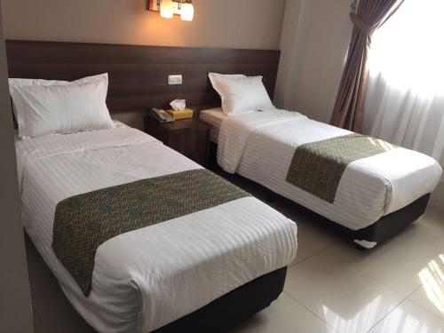 Bunda Hotel Padang - Halal Hotel的一间客房