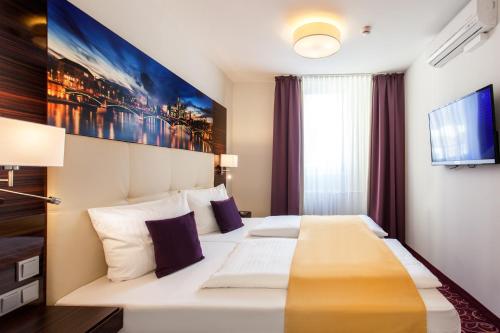 The Domicil Hotel Frankfurt City客房内的一张或多张床位