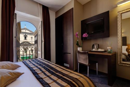 Hotel Rinascimento - Gruppo Trevi Hotels客房内的一张或多张床位
