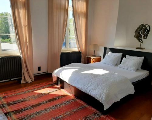 Haras & Hotel Petit-Hallet客房内的一张或多张床位